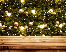 christmas new year background with empty wooden deck table blurred