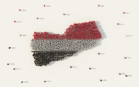 Large group of people forming Yemen map and national flag in soc