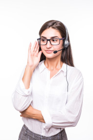 Pretty smiling woman in glasses, wide smile, white shirt with headset isolated on white